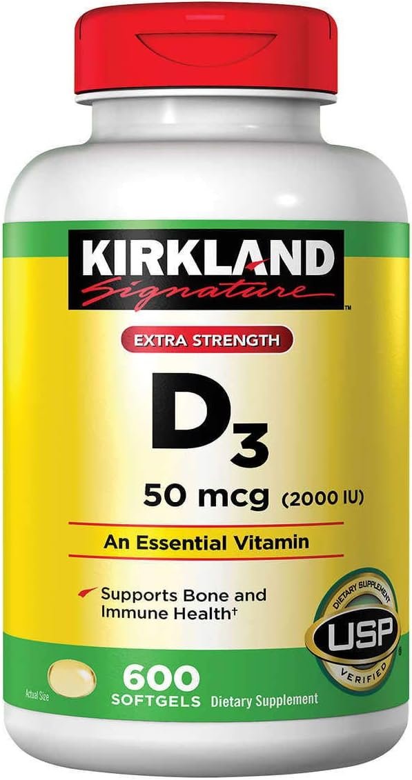 Macro close-up of Kirkland D3 50 mcg softgels showing golden-amber translucent capsules in sharp detail