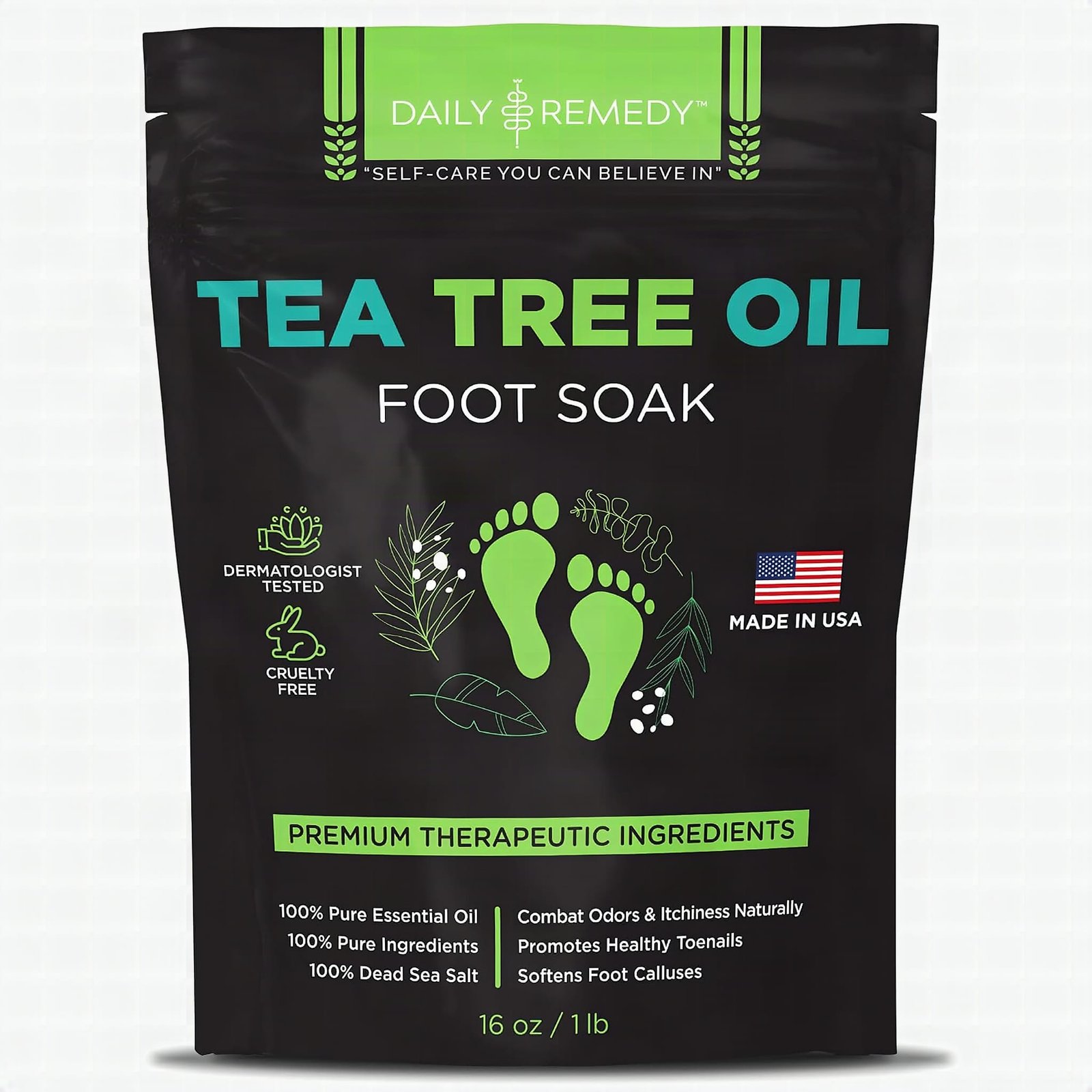 Golden tea tree oil foot soak bottle with epsom salt crystals on dark slate, extreme close-up