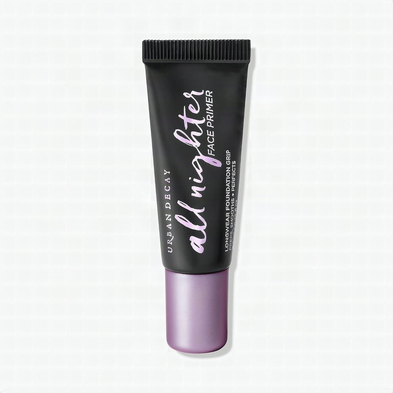 Urban Decay All Nighter primer bottle in macro close-up on marble, gel texture visible with warm studio light