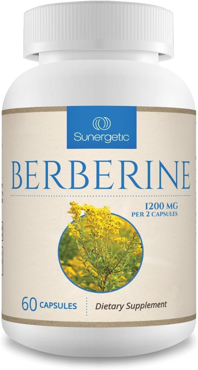 Berberine supplement bottle on bright kitchen counter with water glass, herbs, and journal in morning light