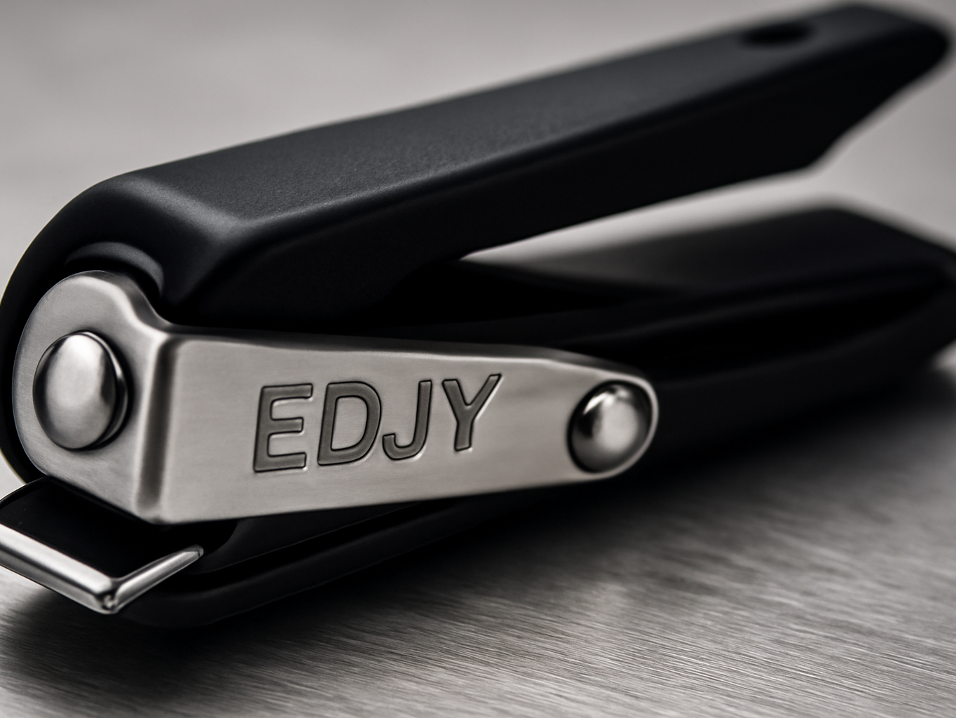 EDJY nail cutter macro close-up showing the safety stop mechanism and sharp stainless steel blade