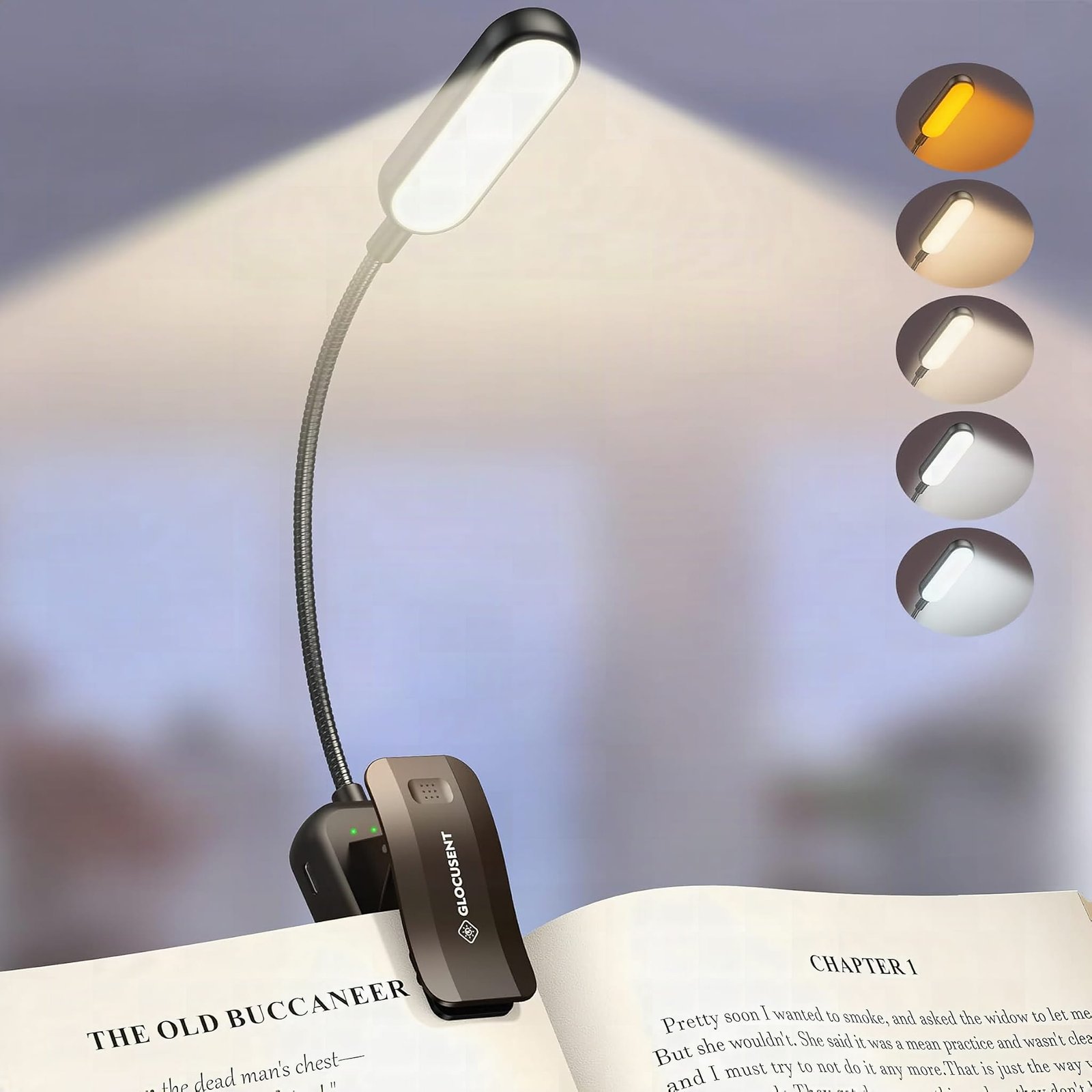 Glocusent LED book light's clip and arm in macro detail with warm light on book pages